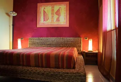 Letto o letti in una camera di Casa Maya
