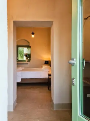 Letto o letti in una camera di Relais Terre di Romanello