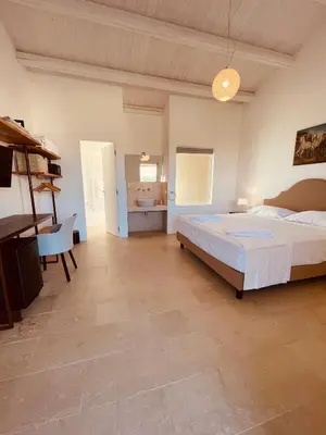 Letto o letti in una camera di Relais Terre di Romanello