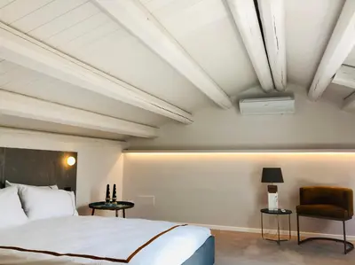Letto o letti in una camera di Alma White Suite