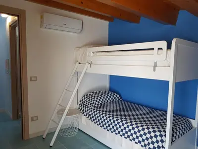 Letto o letti in una camera di Casa La Rosa - Residence Rada delle Tortore