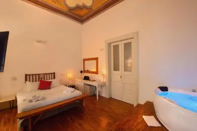 Letto o letti in una camera di Naca Suite