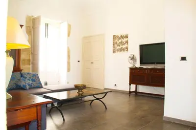 TV o dispositivi per l'intrattenimento presso Residenza Borgia · Residenza Borgia Piazza Duomo View Central Ortigia