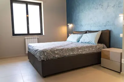 Letto o letti in una camera di Gelone Rooftop and Suites