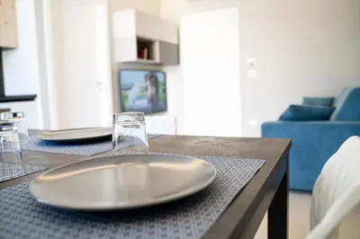 TV o dispositivi per l'intrattenimento presso Gelone Rooftop and Suites