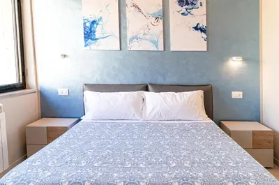 Letto o letti in una camera di Gelone Rooftop and Suites