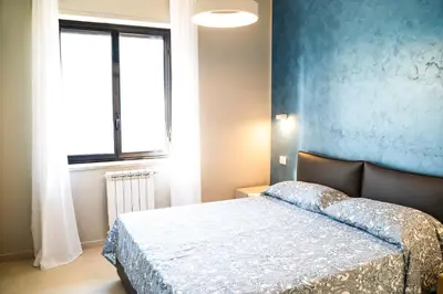 Letto o letti in una camera di Gelone Rooftop and Suites