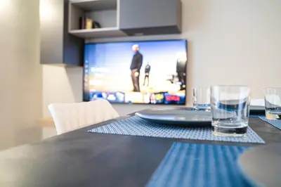 TV o dispositivi per l'intrattenimento presso Gelone Rooftop and Suites