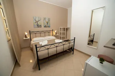 Letto o letti in una camera di b&b Zio Luciano