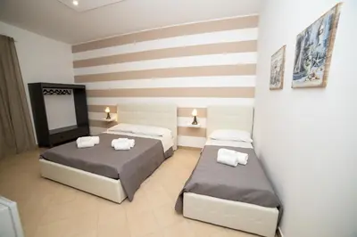 Letto o letti in una camera di b&b Zio Luciano