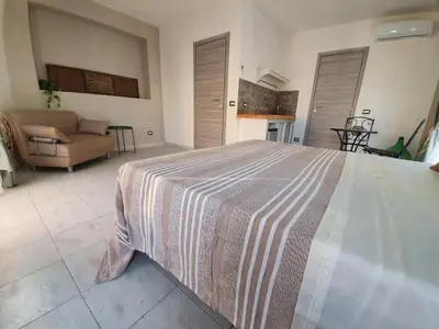 Letto o letti in una camera di B&B città del carrubo