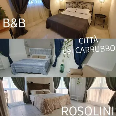 Letto o letti in una camera di B&B città del carrubo