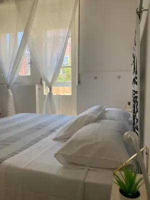 Letto o letti in una camera di B&B Giallolumia