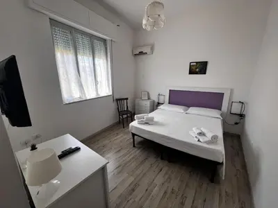 Letto o letti in una camera di B&B Giallolumia