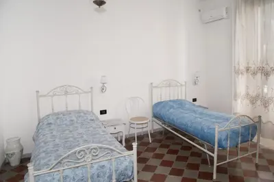 Letto o letti in una camera di MARARETUSA TOURIST APPARTAMENT FOR RENT BREVE - ORTIGIA ISLAND SIRACUSA