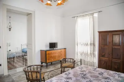 Letto o letti in una camera di MARARETUSA TOURIST APPARTAMENT FOR RENT BREVE - ORTIGIA ISLAND SIRACUSA