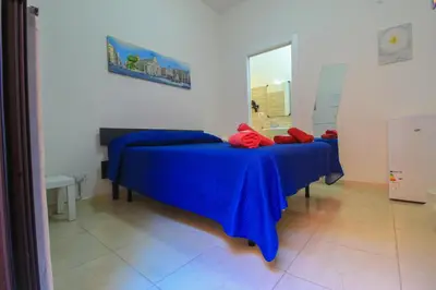 Letto o letti in una camera di BED&FLY NEAR AIRPORT CATANIA FONTANAROSSA BAGNO PRIVATO In CAMERA