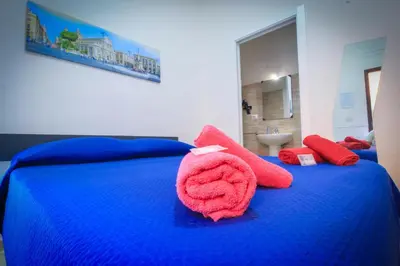 Letto o letti in una camera di BED&FLY NEAR AIRPORT CATANIA FONTANAROSSA BAGNO PRIVATO In CAMERA