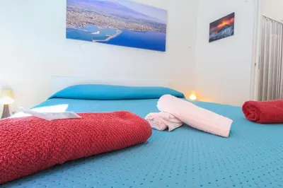 Letto o letti in una camera di BED&FLY NEAR AIRPORT CATANIA FONTANAROSSA BAGNO PRIVATO In CAMERA