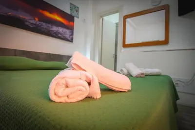 Letto o letti in una camera di BED&FLY NEAR AIRPORT CATANIA FONTANAROSSA BAGNO PRIVATO In CAMERA