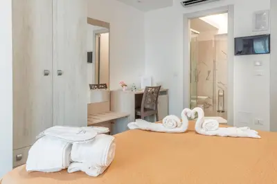 Letto o letti in una camera di Mediterraneo Palace Luxury Affittacamere