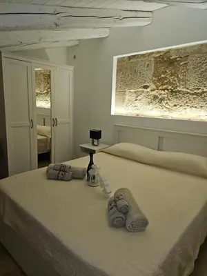 Letto o letti in una camera di Regina Lucia casa vacanze