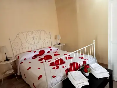 Letto o letti in una camera di Dependance Sabrina