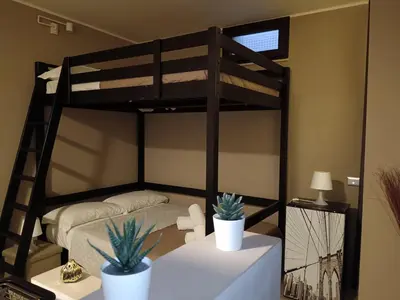 Letto o letti in una camera di U Peri Alivu House