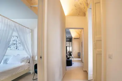 Letto o letti in una camera di Sant'Agostino Luxury Apartments