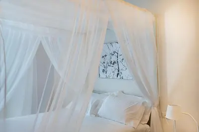 Letto o letti in una camera di Sant'Agostino Luxury Apartments