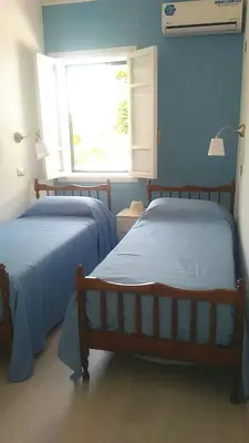 Letto o letti in una camera di Villa delle Muse