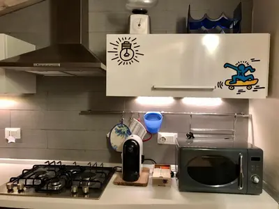 Cucina o angolo cottura di Mansarda Diaz con terrazza a 10 min da Ortigia