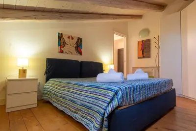 Letto o letti in una camera di Mansarda Diaz con terrazza a 10 min da Ortigia
