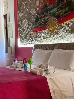 Letto o letti in una camera di B&B L'Infiorescenza new