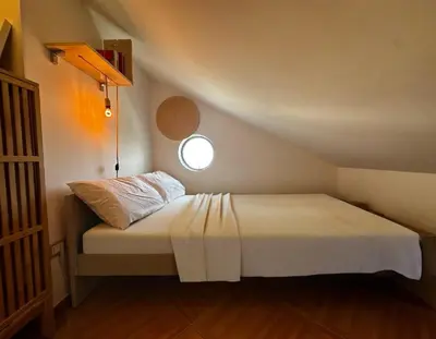 Letto o letti in una camera di Rita's Apt&Rooms