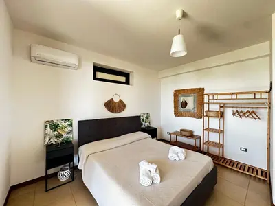 Letto o letti in una camera di Rita's Apt&Rooms