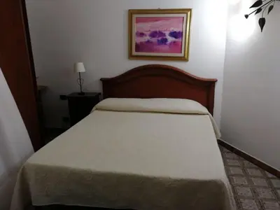 Letto o letti in una camera di Arenella Beach Rooms