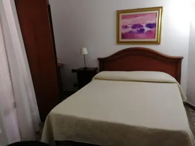 Letto o letti in una camera di Arenella Beach Rooms
