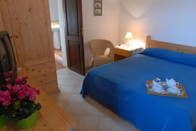 Letto o letti in una camera di San Domenico Residence