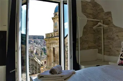 Letto o letti in una camera di B&B Belvedere All'Idria