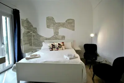 Letto o letti in una camera di B&B Belvedere All'Idria