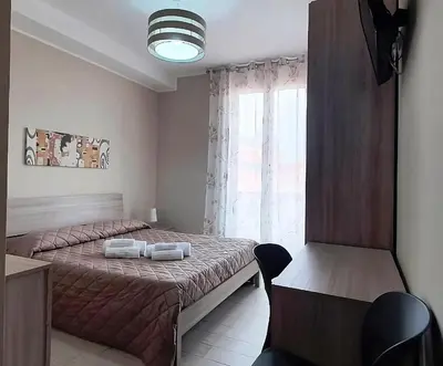 Letto o letti in una camera di Giliberto Rooms