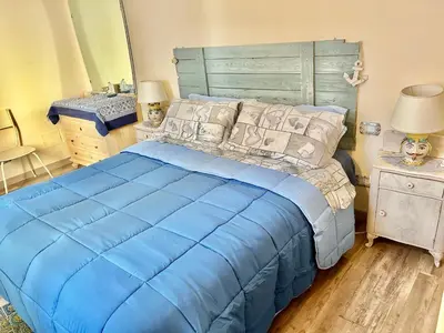 Letto o letti in una camera di Casa Filemone
