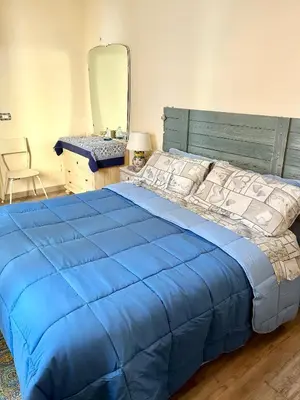 Letto o letti in una camera di Casa Filemone