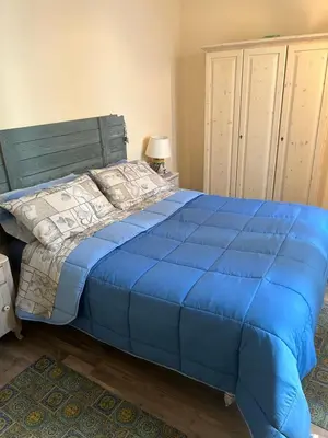 Letto o letti in una camera di Casa Filemone