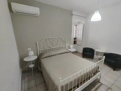 Letto o letti in una camera di B&B Del Carmine