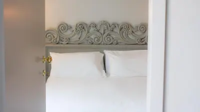 Letto o letti in una camera di Room 55