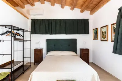 Letto o letti in una camera di Agriturismo Val Di Noto