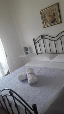 Letto o letti in una camera di Villa Midolo