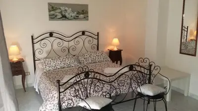Letto o letti in una camera di Villa Midolo